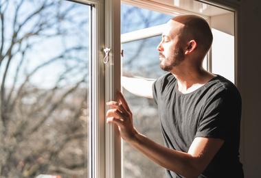 man-in-Scarborough-looking-out-of-newly-replaced-window
