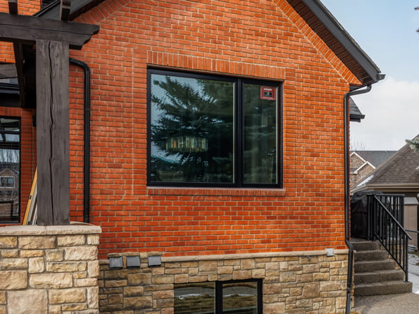 Heritage Pointe, De Winton, AB – Draftlock Plus triple pane windows and Amalfi patio door, exterior view