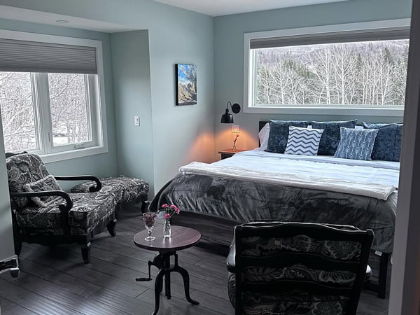 Longview, AB – new windows added with wall cut-outs and reframing to open up the views, interior view