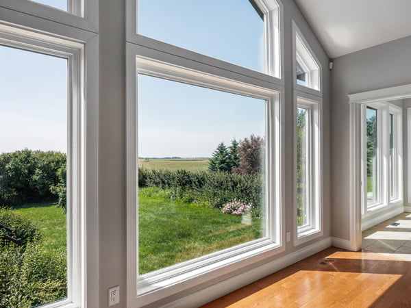 Sturgeon County, AB – black trapezoid triple-pane windows, interior bay view
