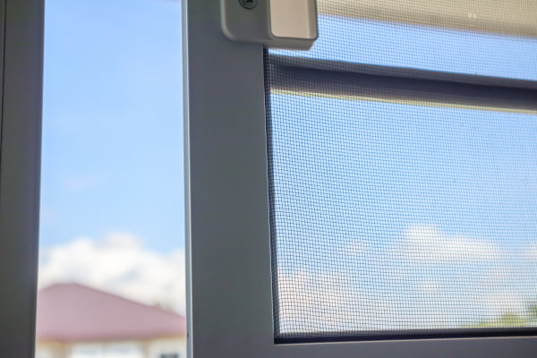 retractable screen door letting fresh air into home