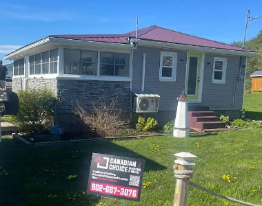 Completed residential window installation project with upgraded energy-efficient windows and exterior home renovation