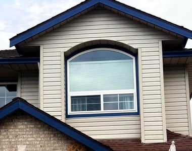 Arched vinyl window replacement with sliding windows on a Vancouver home