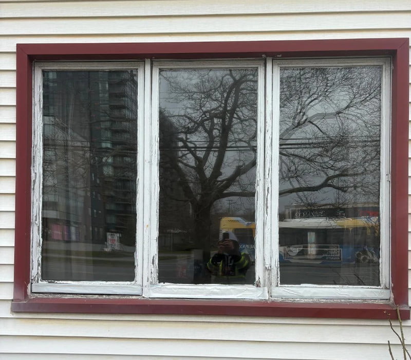 * Before: Old residential window before replacement in South End Halifax